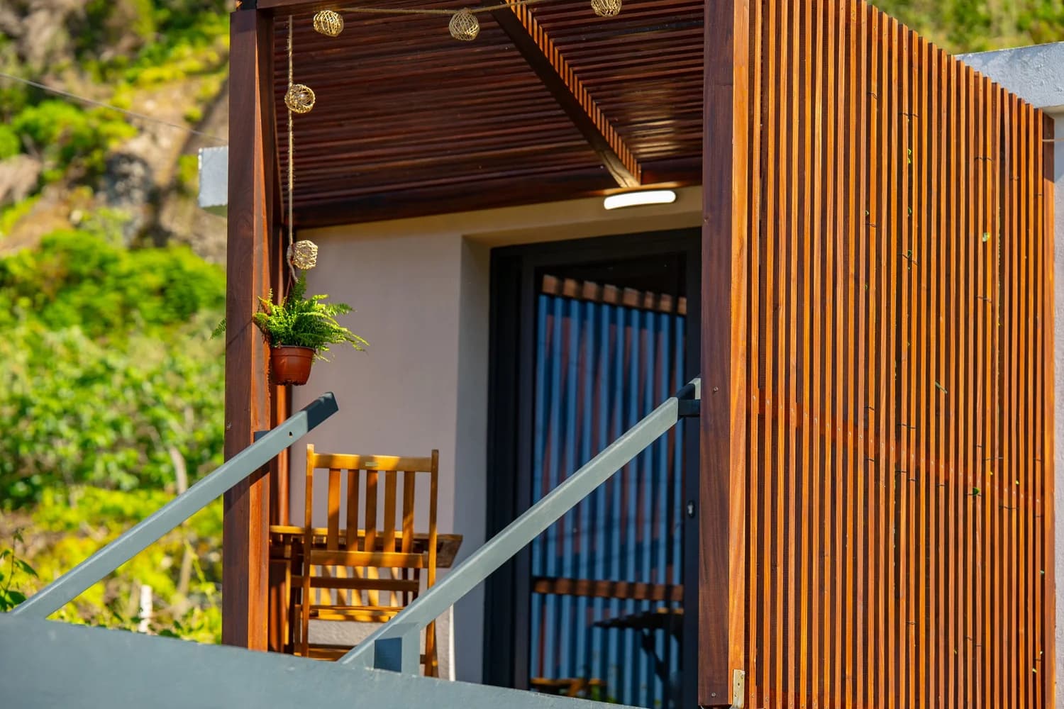 Wooden slatted entrance with plants at Studio Ash, Fajã Lodges