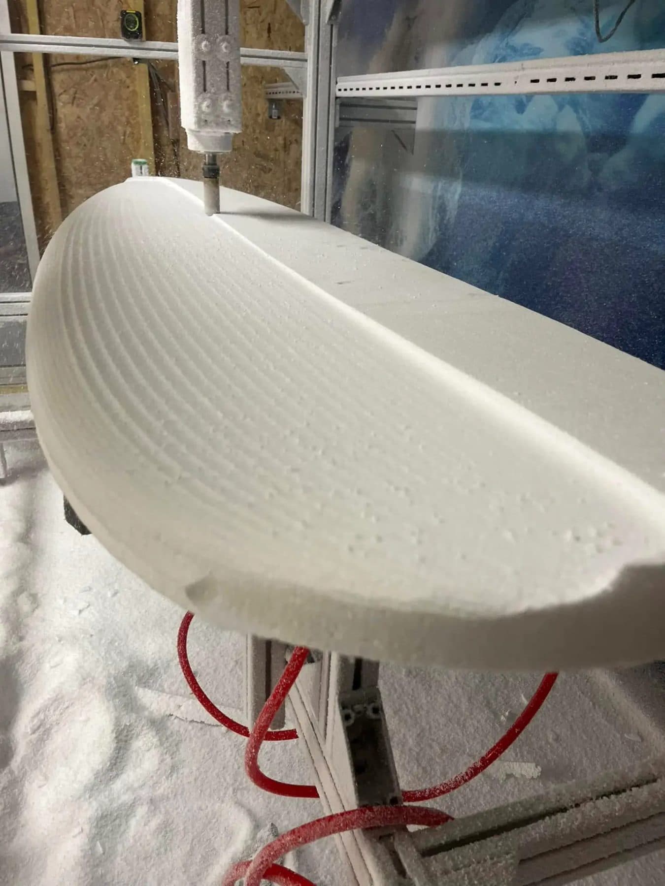 The CNC machine milling a surfboard blank at Fajã Surf Labs